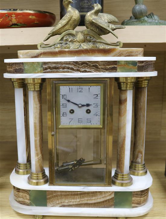 A 1930s polychrome onyx portico mantel clock, height 53cm
